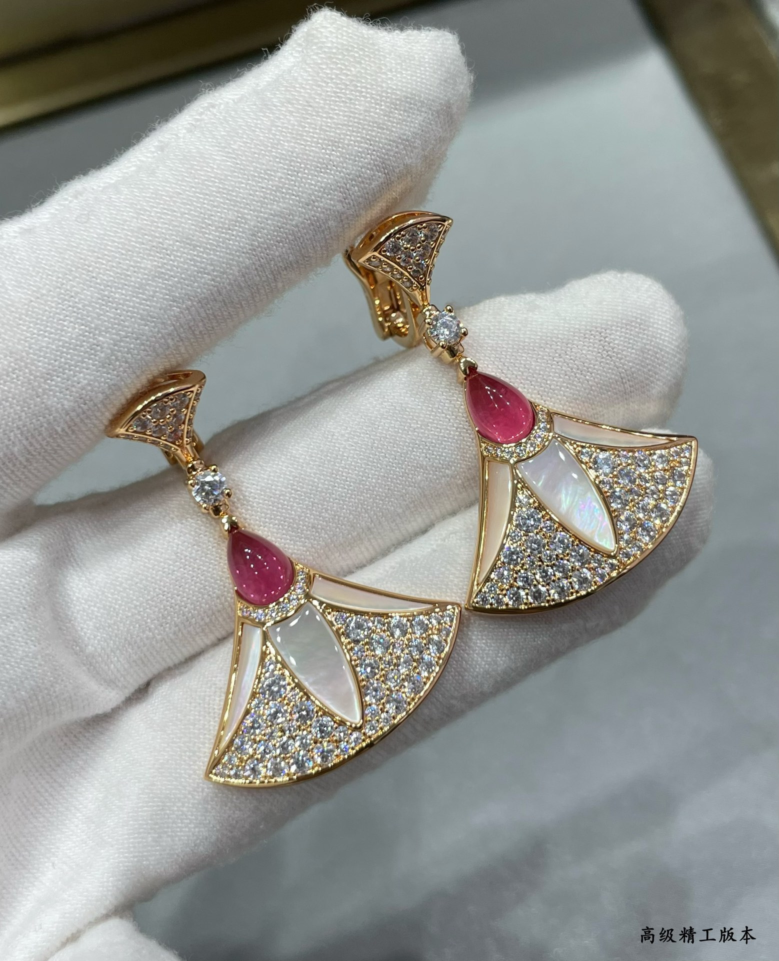 B*l*ai roman fan earrings
