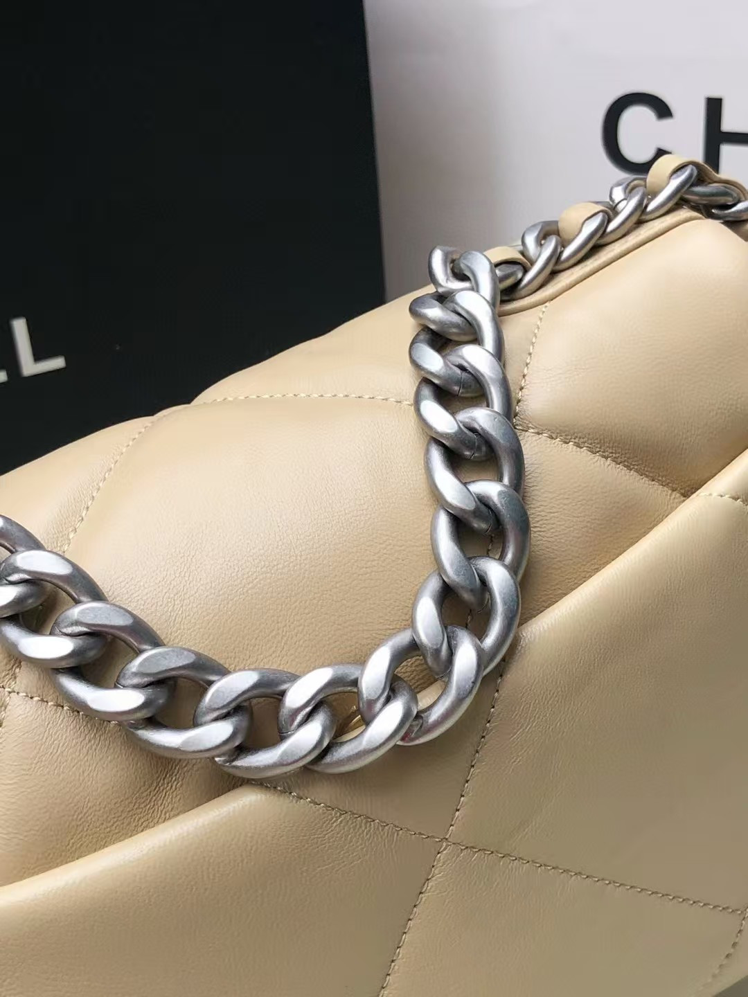 Ch*el 19 handbag shiny leather, gold-tone, silver-tone & ruthenium-finish metal beige 26x16x9cm