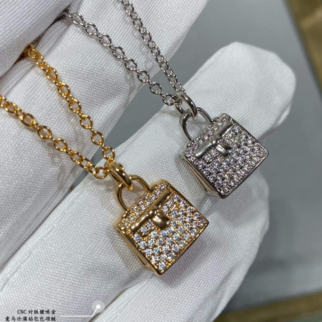 H**mes fully di*m*nd-encrusted bag necklace