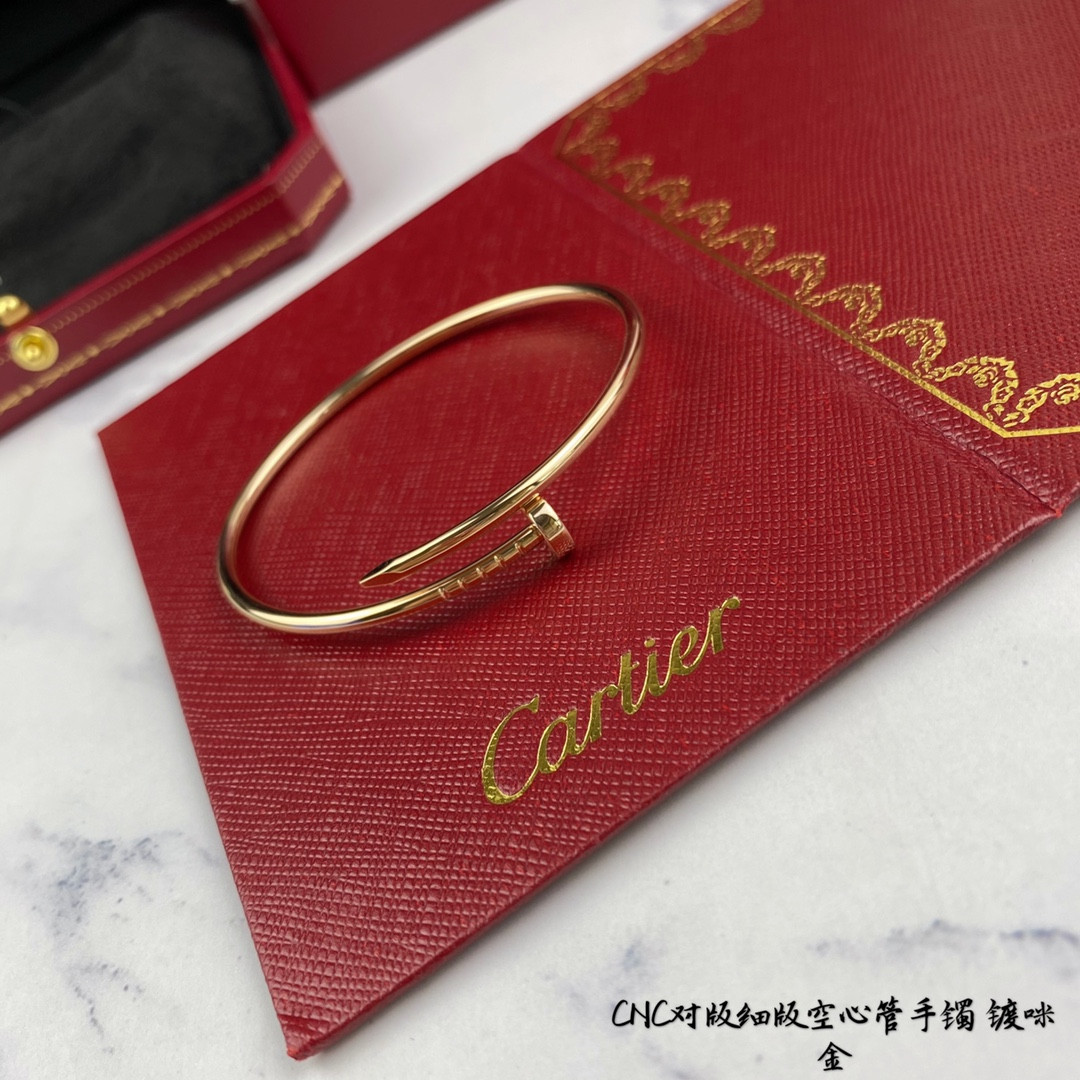 Ca*t*er thin hollow tube polished nail bracelet