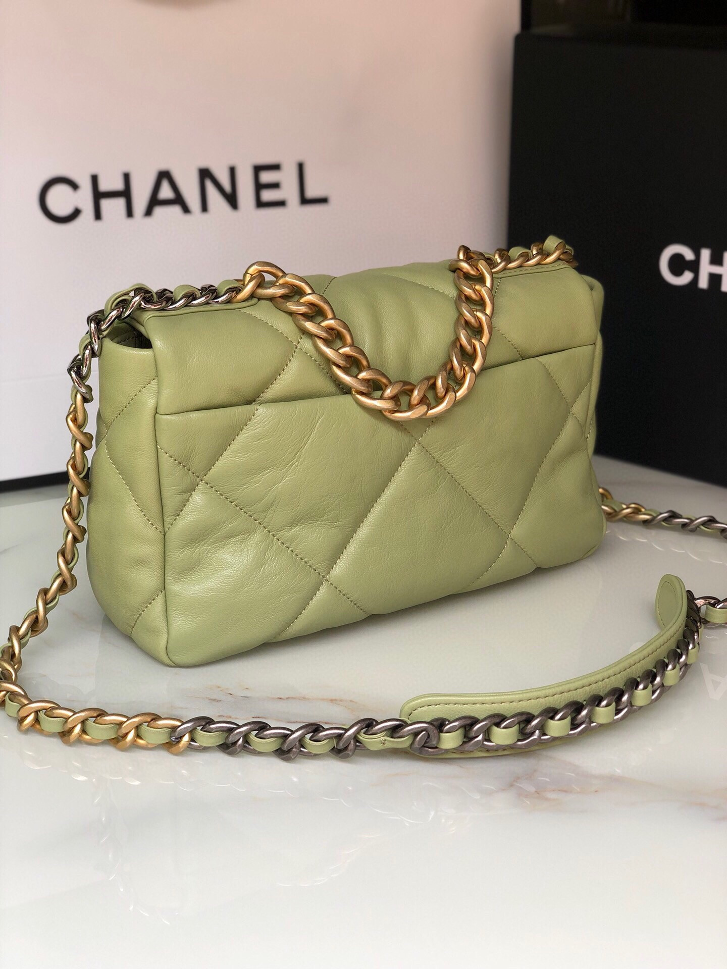 Ch*el 19 handbag shiny leather, gold-tone, silver-tone & ruthenium-finish metal light green 6.2 × 10.1 × 3.5 in
