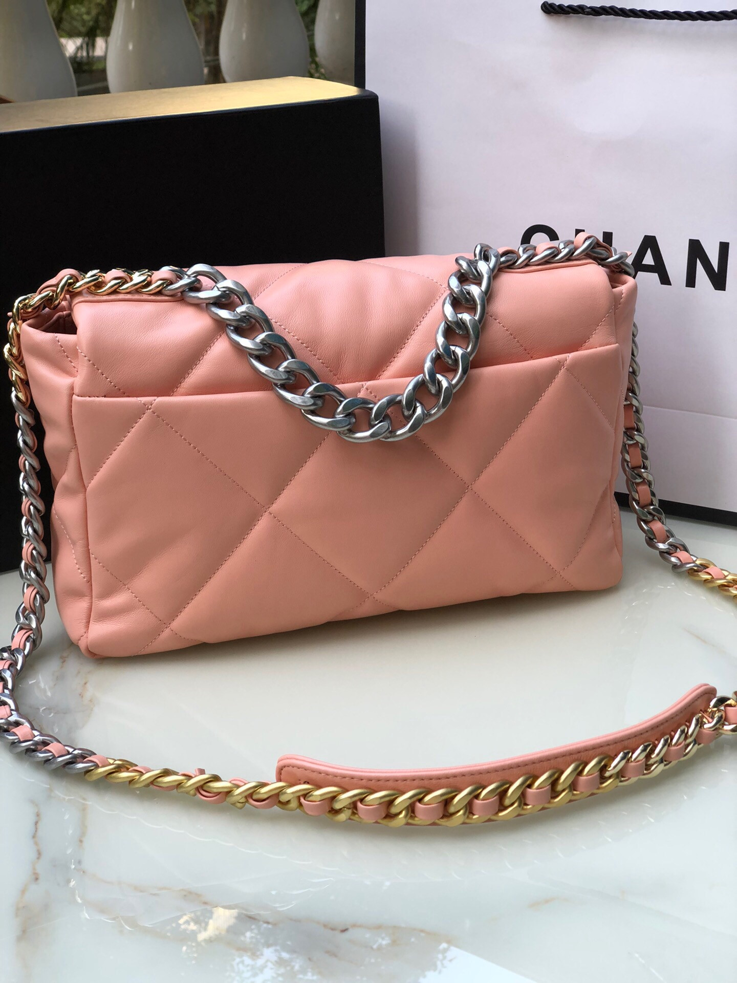 Ch*el 19 large handbag shiny leather, gold-tone, silver-tone & ruthenium-finish metal light pink 7.8 × 11.7 × 3.9 in