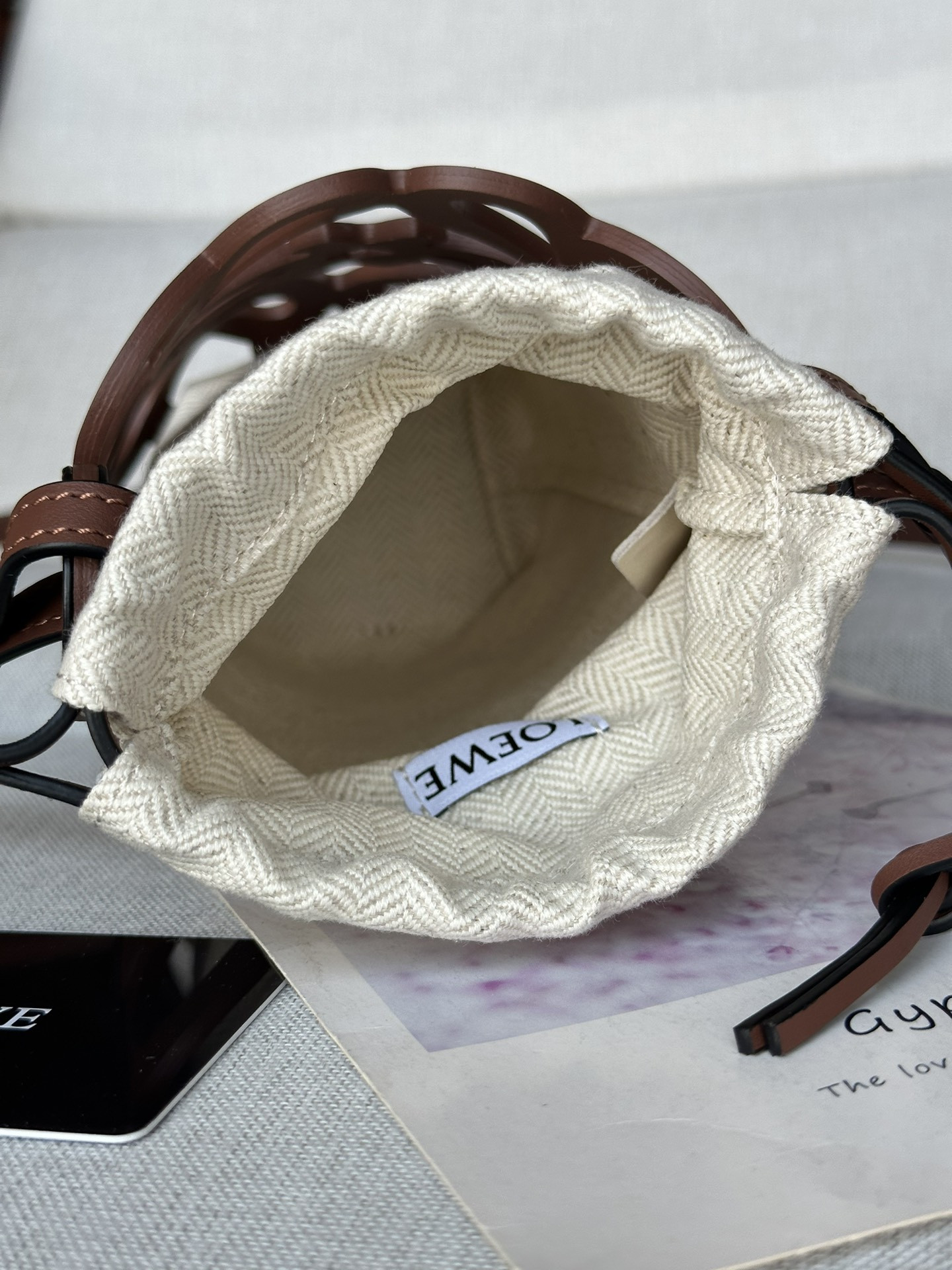 L0ew* anagram cut-out pocket in classic calfskin and canvas 20x11x8cm